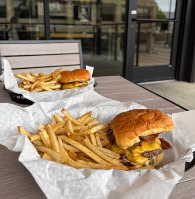 Rooftop patio seating with burger baskets